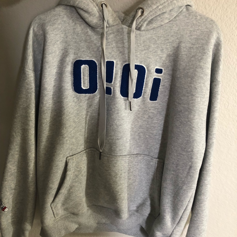 hoodie with “badminton” on sleeves